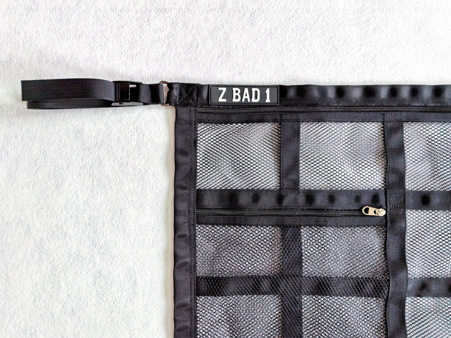 Close-up of the corner strap, buckle and zip pocket on the ZBAD1 Gen 2 cargo net