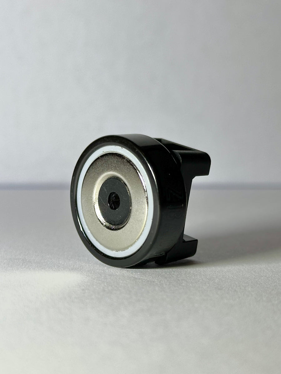 Underside of a ZBAD1 magnet cable tie holder showing the magnetic base