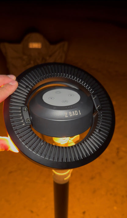 Close-up of the ZBAD1 Ultimate Illuminator ring light glowing warm amber on its mast