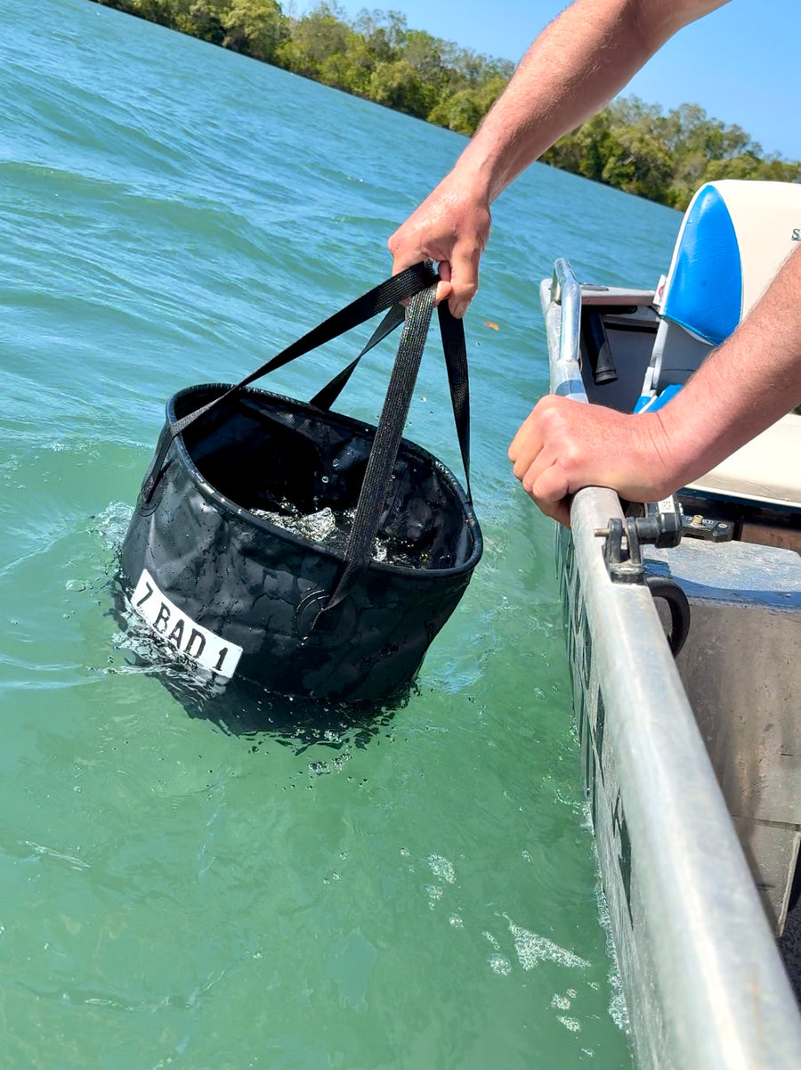 ZBAD1 flexi stowaway bucket being filled with water over the side of a boat