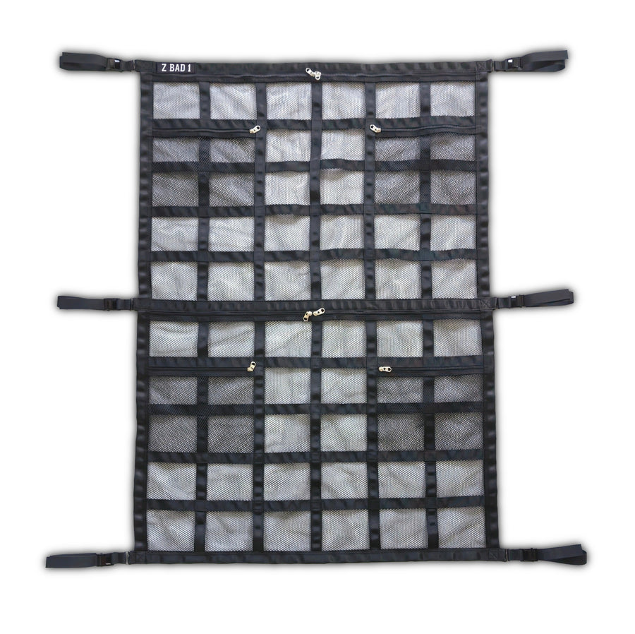 ZBAD1 full length cargo net laid flat, showing two panels of mesh pockets with zips and mounting straps