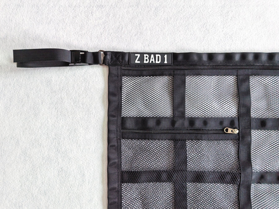 Close-up of the corner strap, buckle and zip pocket on the ZBAD1 full length cargo net